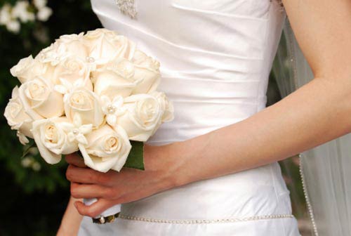 white rose posy bouquet combined with staphanotis