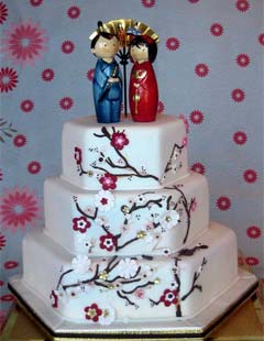 Hexagon shaped, Japanese wedding cake decorated with cherry blossoms