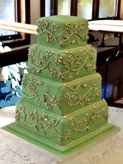 Square four tier green and gold brocade fall wedding cake