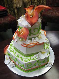 Three tier white, green and orange theme hexagon cake