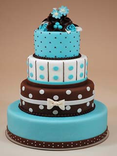Four tier chocolate brown and blue polka dot fondant wedding cake
