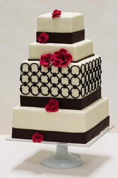 Four tier 1930's inspired brown and white wedding cake decorated with art deco circle elements
