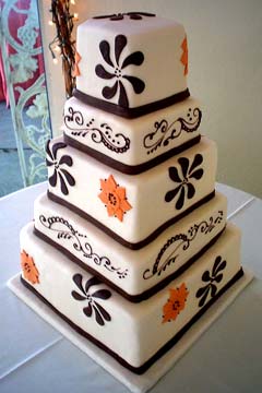 Five tier 1970's style white, orange and black super cool wedding cake