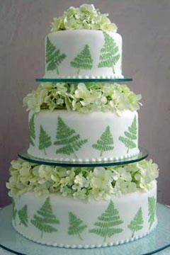 Three tier pistachio green and white wedding cake