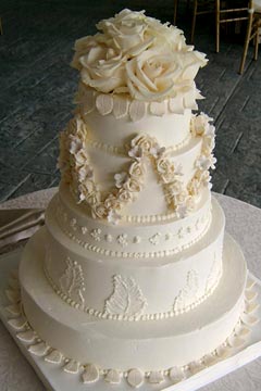 Traditional, five tier ivory buttercream classic style wedding cake