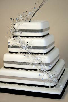 Four tier silver, black and white square wedding cake