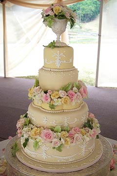 Four tier cream Victorian sytle rolled fondant wedding cak