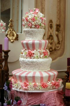 four tier pink and white wedding cake
