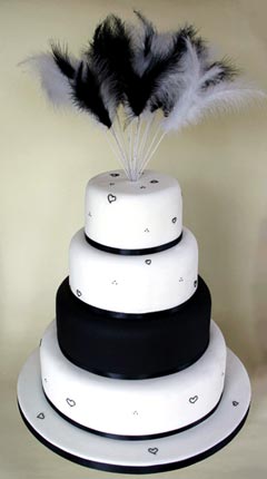 theatrical four tier white and black wedding cake