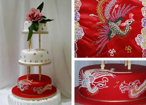 Two white and one red satellite cakes with the dragon and phoenix embroidery on the bottom red tier