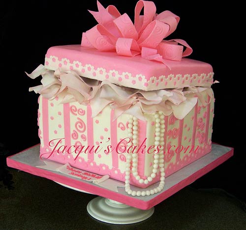 white and pink one tier gift box wedding cake