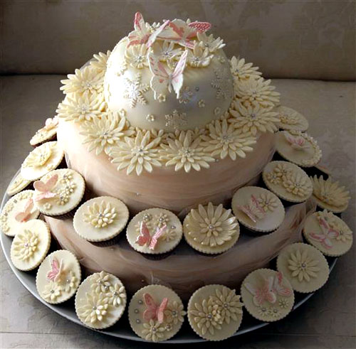 Two tier romantic style ivory cupcake tiered wedding cake