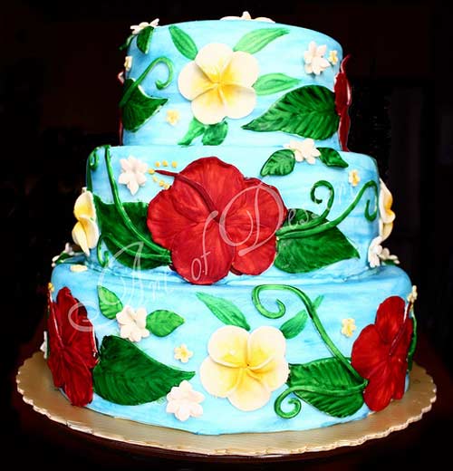 Tropical three tier hand painted hawaiian theme wedding cake design. Decorated in blue, red, green and yellow