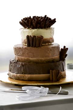Three tiered chocolate flavoured cake; white, milk and dark chocolate