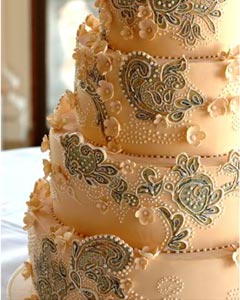 Four tier embroidery wedding cake. The wedding dress cake design based on a couture wedding dress