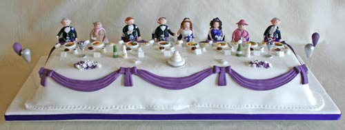 Novelty wedding cake with caricatures of the entire bridal party