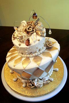 Two tier, mad hatter, white and gold wedding cake