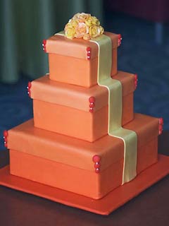 Three tier square orange gift box wedding cake made to look like a present