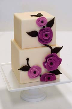 square two tier 1930's inspired wedding cake decorated with pinkish purple hand made fondant florals