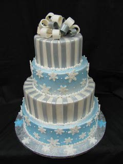 four tier white, silver and blue snowflake wedding cake