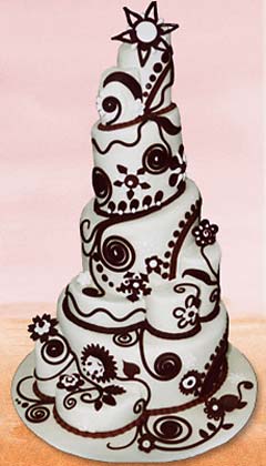 Five tier white and brown topsy turvy whimsical cake